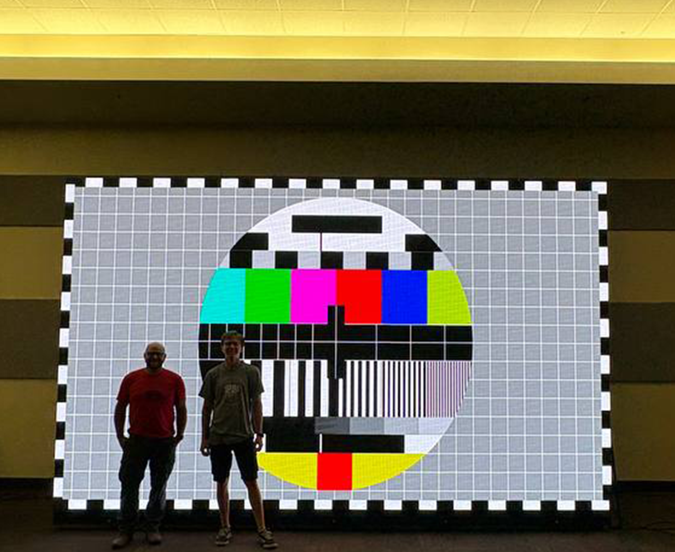 LED video wall in use, owner in front of it